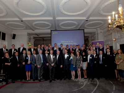 Amicus stakeholders standing in front of a project screen