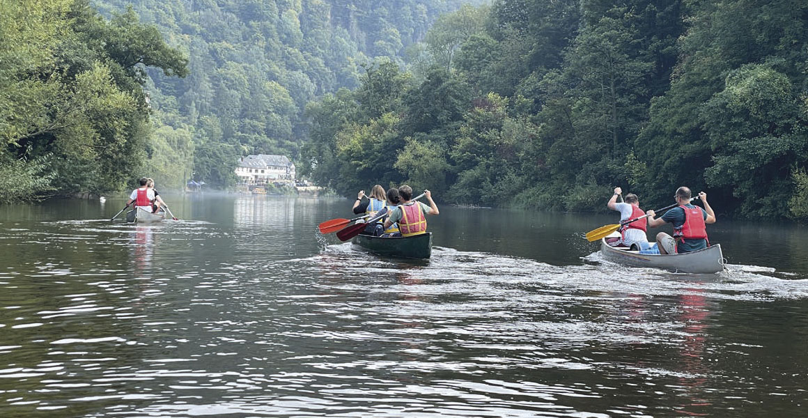 The mark-makers are paddling down the River Wye towards the finish at Symonds Yat.