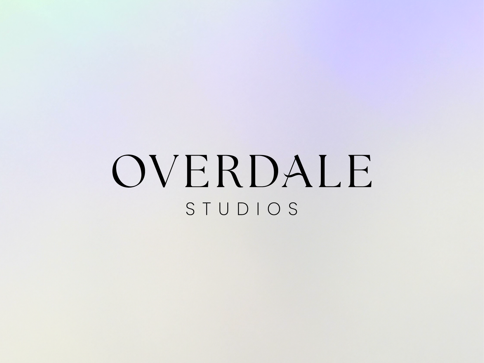 The Overdale Studios logo displayed in elegant black serif lettering on a soft gradient background of pastel shades, blending pale blue, purple, and cream. This minimalist design reflects the creative vision and aspirational ethos of Overdale Studios, as discussed in the blog post about David Souch’s artistic journey and plans for his future studio.